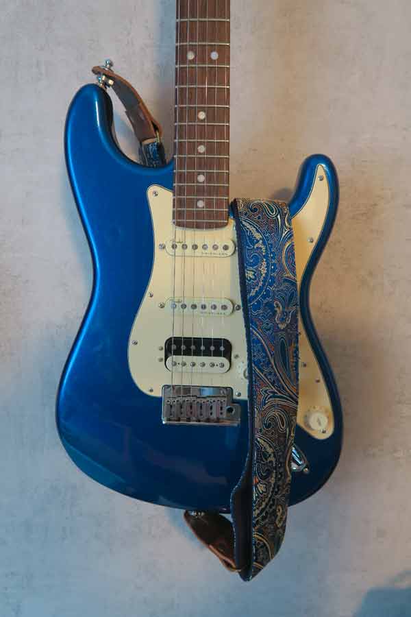blue fender stratocaster with paisley guitar strap