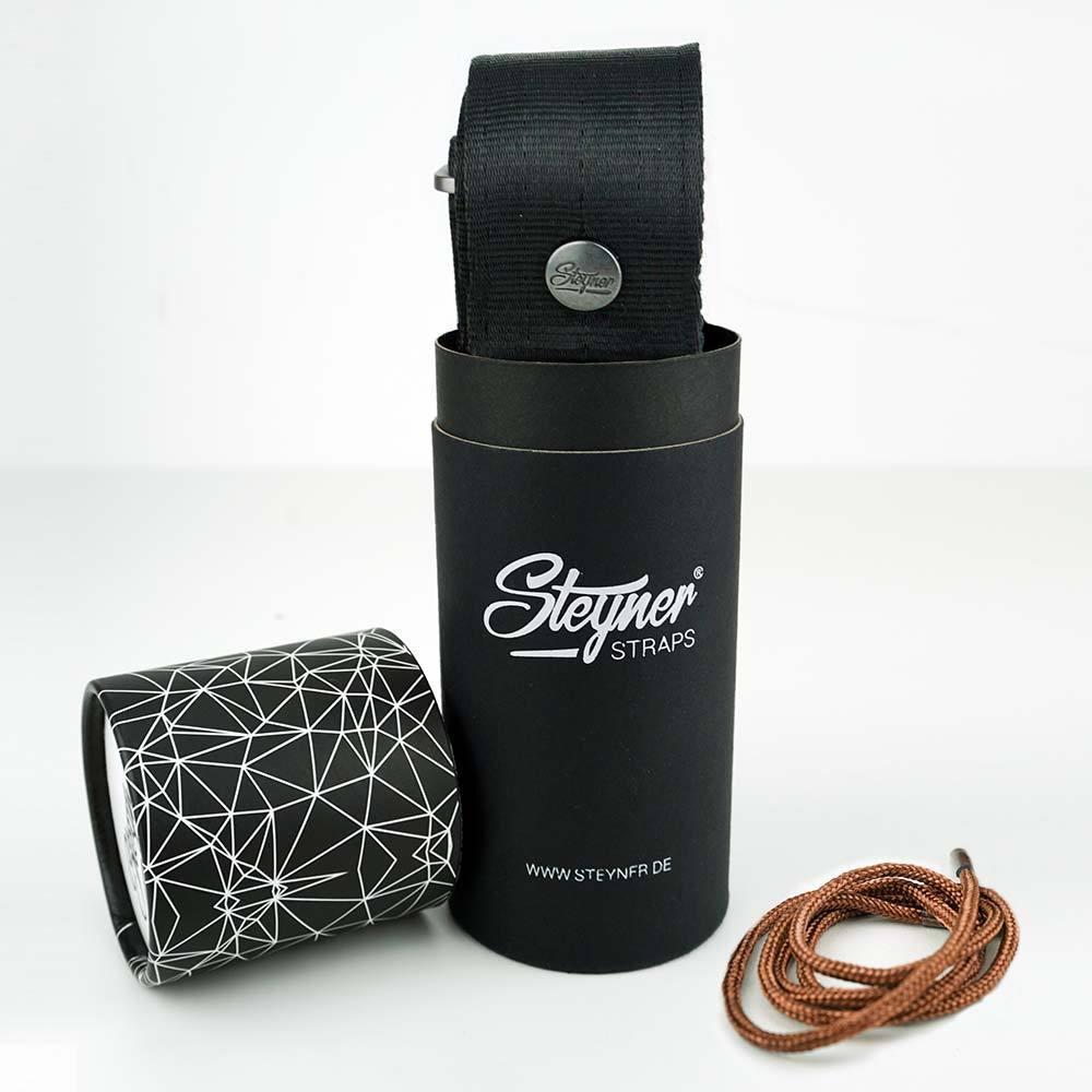 Geschenkdose mit schwarzem Nylon Gitarrengurt