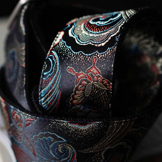 Bester Gitarrengurt in schwarz mit buntem Blumen Muster rutschfeste Unterseite aus Baumwollband