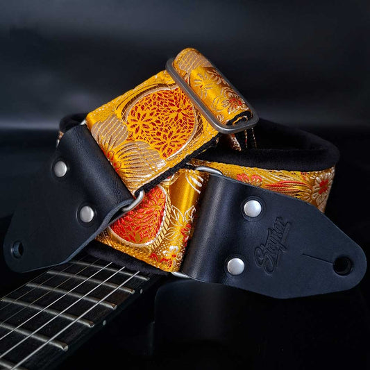 Gepolsterter Premium Gitarrengurt – Tropical Mango 70 mm (schwarz-silber)