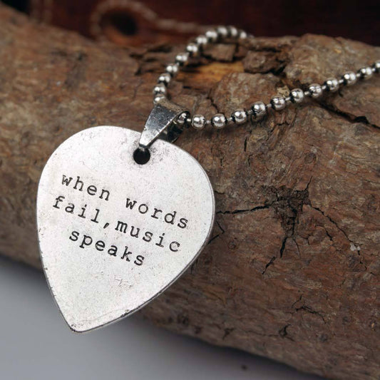Plektrum Kette aus Edelstahl mit Spruch When words fails music speaks