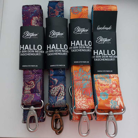 Colorful bag strap with "wild rose" carabiner